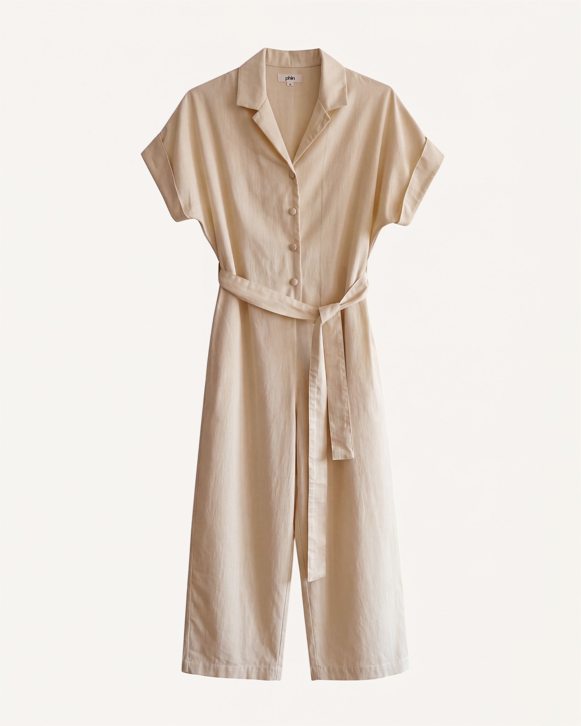 Petite model wearing the Petite Jumpsuit Ecru front view.