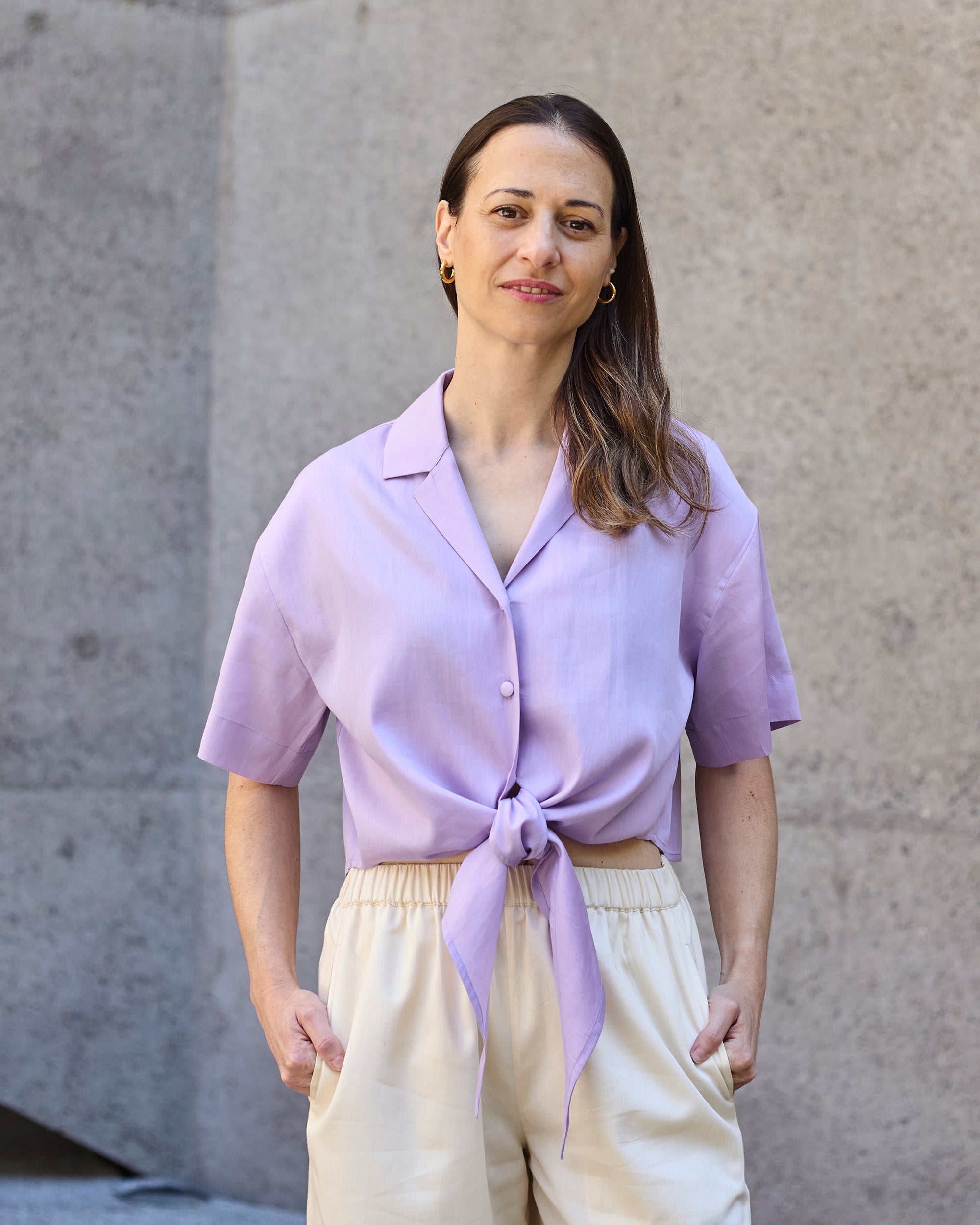Front view of a petite model wearing the Wrap Blouse Lilac.