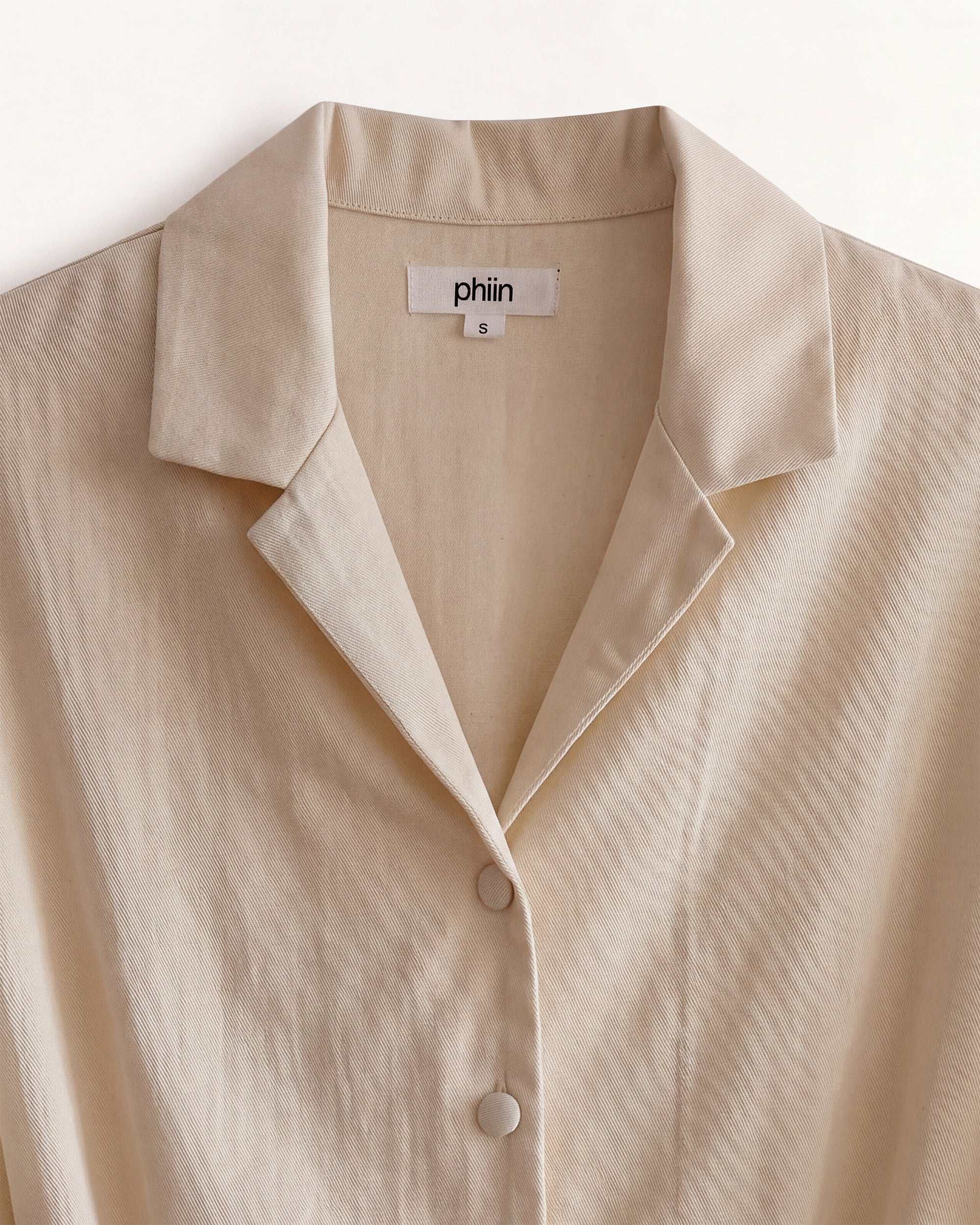 Detail view of the Petite Jumpsuit Ecru.